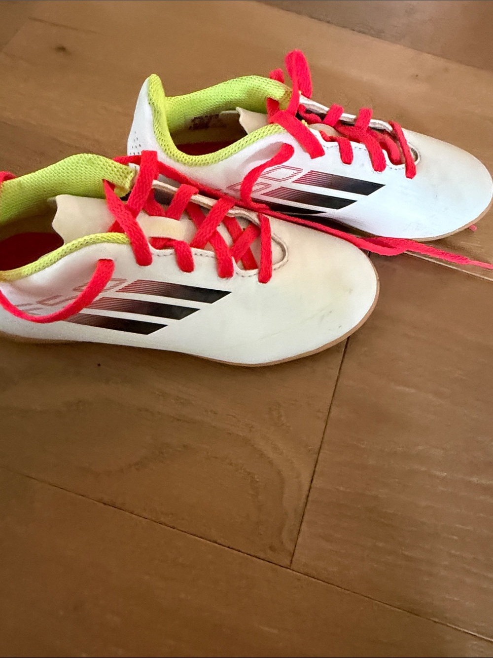 Kids White indoor soccer cleats with Neon Pink Laces and Lime Trim